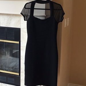 Black cocktail dress with shear back and sleeves